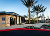 Thumbnail 30 of 37 - The image shows a building with the number 11850 on it, surrounded by palm trees and a clear sky.