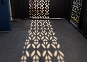 Thumbnail 37 of 37 - A shadow of a decorative fence is cast on the ground.