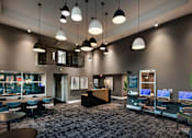 Thumbnail 105 of 116 - A modern office space with a reception desk and multiple workstations.