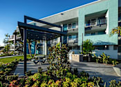 Thumbnail 99 of 116 - A modern building with a large open area in front.