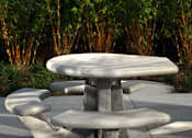 Thumbnail 83 of 116 - A grey table and two chairs are in front of a green shrubbery.