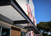 Thumbnail 50 of 116 - A building with a colorful mural on the side.