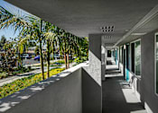 Thumbnail 16 of 116 - A long, narrow walkway with a concrete ceiling and walls.