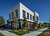 Thumbnail 15 of 116 - A modern building with a grey facade and a bicycle parked in front.