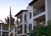 Thumbnail 107 of 114 - A building with a flag on top of it.