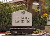 Thumbnail 66 of 114 - A sign that says "HEROES LANDING" in front of a building.