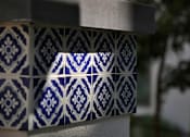 Thumbnail 49 of 114 - A close up of a blue and white tiled wall.
