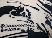 Thumbnail 53 of 114 - A black and white abstract painting with the text "@facesofsantana & @zazooned" at the bottom.