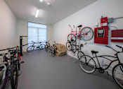 Thumbnail 28 of 114 - A bike parking room with a red box on the wall.