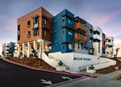 Thumbnail 10 of 103 - A modern apartment complex named Milejo Village is shown.