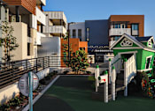 Thumbnail 57 of 103 - A playground with a green slide and a white fence.