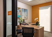 Thumbnail 38 of 103 - A modern office with a glass door and a sign that says "OFFICE".