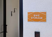 Thumbnail 89 of 103 - A sign that says Bike Storage is on a white wall.