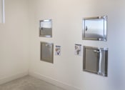 Thumbnail 99 of 103 - Three metal framed mirrors are on a wall.