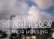 Thumbnail 94 of 94 - Pelican Harbor Senior Housing logo on a blurred background.