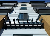 Thumbnail 91 of 94 - A building with a blue sky in the background.