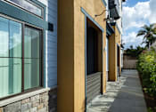 Thumbnail 56 of 94 - A row of houses with a sidewalk in front.