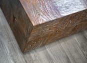 Thumbnail 53 of 94 - A wooden box with a metallic finish on one side is placed on a grey surface.