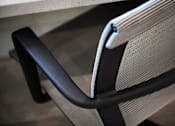 Thumbnail 51 of 94 - A close up of a black and grey chair with a black armrest.