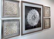 Thumbnail 50 of 94 - Four framed artworks are displayed on a wall.