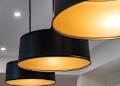 Thumbnail 90 of 90 - Three black lampshades hanging from the ceiling.