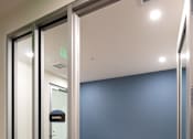 Thumbnail 34 of 90 - A glass door with a sign that says "EXIT" on it.