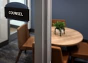 Thumbnail 60 of 90 - A sign that says "COUNSEL" hangs above a table with chairs.