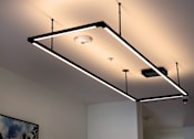 Thumbnail 19 of 90 - A modern ceiling light fixture with a rectangular frame and a single light bulb.