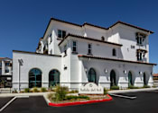 Thumbnail 16 of 90 - A white building with the name Salida del Sol on it.