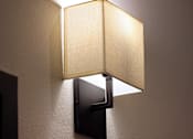 Thumbnail 6 of 90 - A wall-mounted lamp with a square shade and a rectangular base.