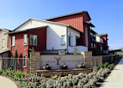 Thumbnail 7 of 25 - A red and white building with a sign that says Sierra Fountains.