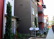 Thumbnail 13 of 25 - A satellite dish is in the front yard of a house.