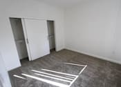 Thumbnail 10 of 25 - A room with a grey carpet and white lines drawn on it.
