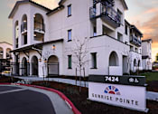 Thumbnail 32 of 61 - A building with the number 7424 and the name Sunrise Pointe on a sign in front of it.