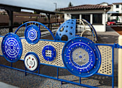 Thumbnail 2 of 61 - A playground with a blue and white play structure.