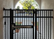 Thumbnail 47 of 61 - A black gate is closed with a handle on top.