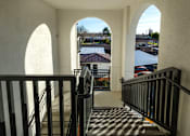Thumbnail 54 of 61 - A view from the top of a staircase looking down at a black and white checkered floor.