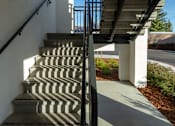 Thumbnail 52 of 61 - A set of stairs with a metal railing on the side.