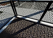 Thumbnail 37 of 61 - A black and white geometric patterned wall.