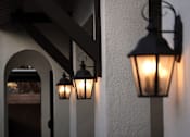 Thumbnail 46 of 61 - Three hanging lights on a wall.