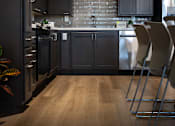 Thumbnail 114 of 127 - A kitchen with dark wood cabinets and a brick backsplash.