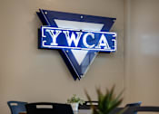 Thumbnail 105 of 127 - A conference room with a YWCA sign on the wall.