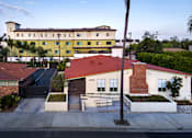 Thumbnail 74 of 127 - A building with a red roof is in the foreground of the image.