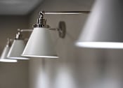 Thumbnail 19 of 127 - Three lights are hanging from a silver fixture.