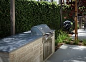 Thumbnail 3 of 127 - A grey trash can with a black trash bag in it.