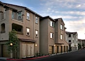 Thumbnail 101 of 117 - A long row of houses with garages.