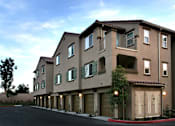 Thumbnail 91 of 117 - A large apartment building with a parking lot in front.