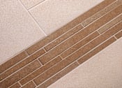 Thumbnail 59 of 117 - A brown brick is laid on a white tile floor.