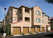 Thumbnail 30 of 117 - A row of houses with brown garage doors.