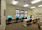 Thumbnail 50 of 117 - A room with multiple computers and chairs.